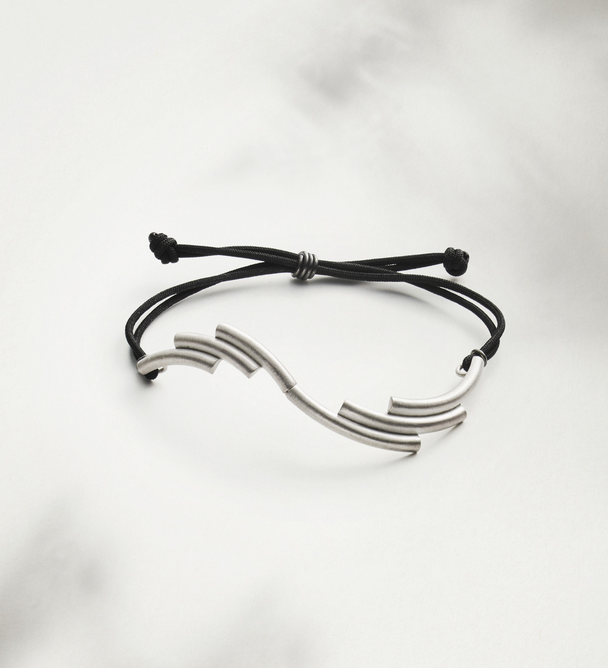 Silver Flux bracelet with black ribbon